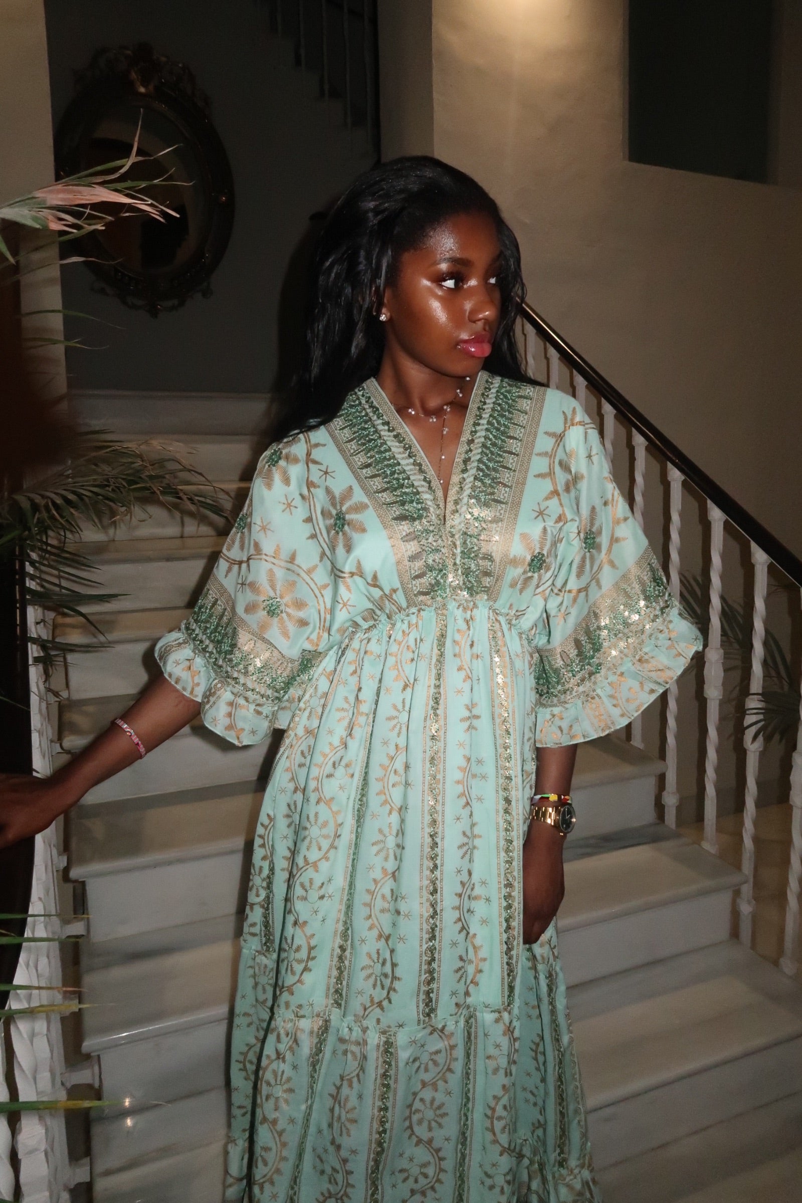 Model wearing the Espera Dress in white, standing in a Moroccan-style mansion, Casa Calissta collection.

Front view of the turquoise Espera Dress, 100% cotton boho kaftan, shown in an elegant Egyptian courtyard.

Bright blue Espera Dress by Casa Calissta, styled with gold jewelry, photographed in a sunlit Moroccan mansion.

Sea blue free-size kaftan maxi dress with Moroccan embroidery, worn by model in Egyptian villa setting.

Bohemian summer dress in cotton, Casa Calissta Espera design in white, captured 